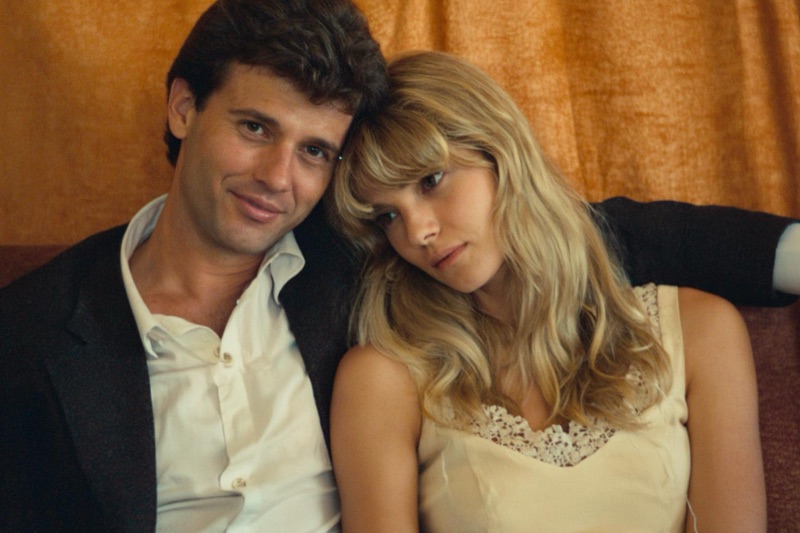 Orange Curtain · by NowhereManGo · couple portrait, orange backdrop, dark blazer