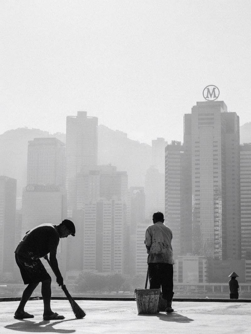 Rooftop Morning · by NowhereManGo · black and white, rooftop workers, hazy skyline
