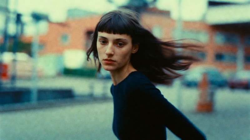 In Undertow · by Felix · turning portraits, hair pulled off frame, panning blur