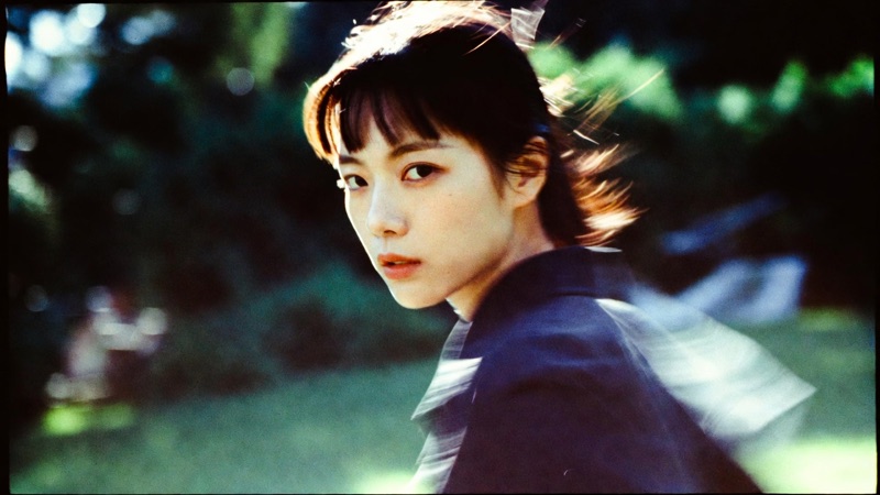 Mid-Turn · by Felix · turning portraits, hair in motion, film borders